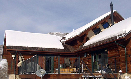 Roof de-icing system installed along roof edges and in valleys